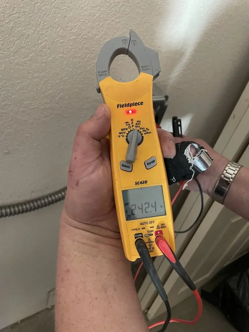 Voltage testing with clamp meter during Electrical Installation Services in Ashland